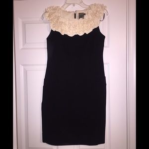Fitted black dress with cream details