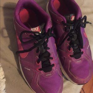 Purple Nike running shoes