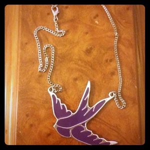 A purple swallow bird necklace