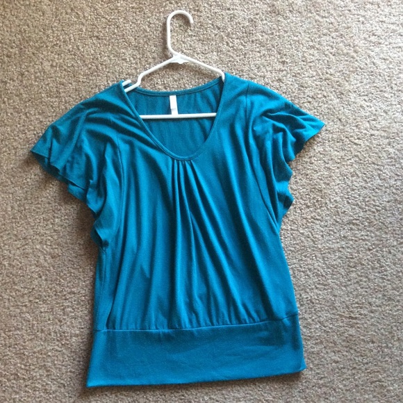 Blue pleated top with flowy shoulders