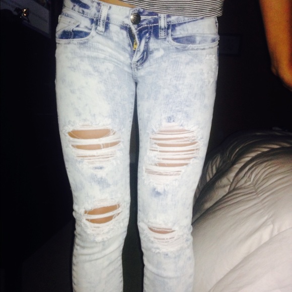 Acid wash ripped jeans