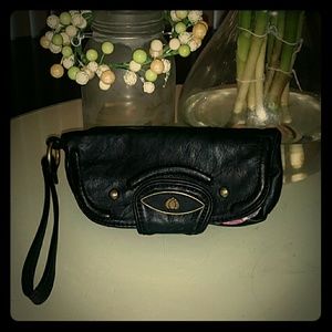 Nica UK black wristlet with bright floral lining