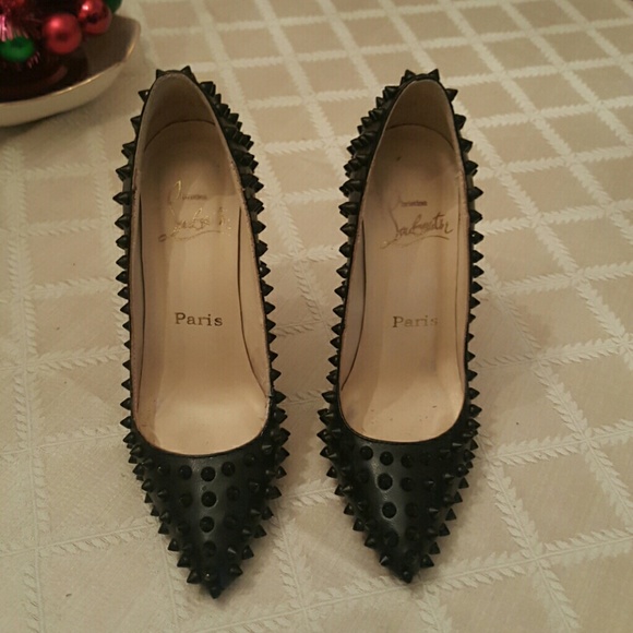 Spiked red bottoms with all cl markings