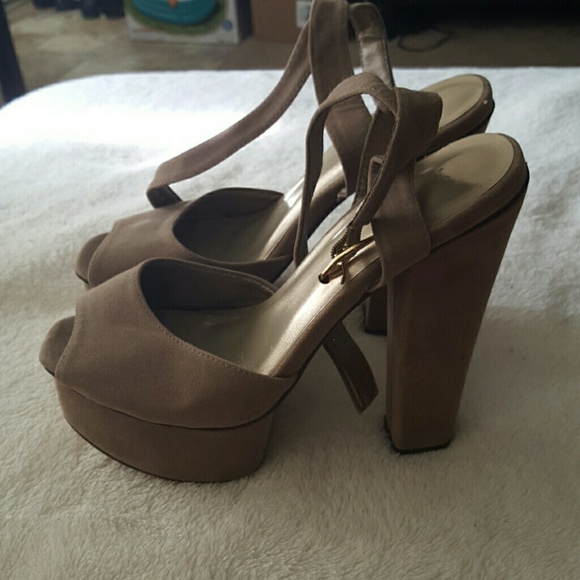 Taupe colored strap heels with platform.