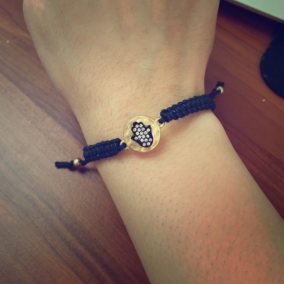 Black adjustable bracelet with gold hand