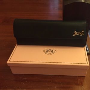 Black mini clutch by Juicy Couture