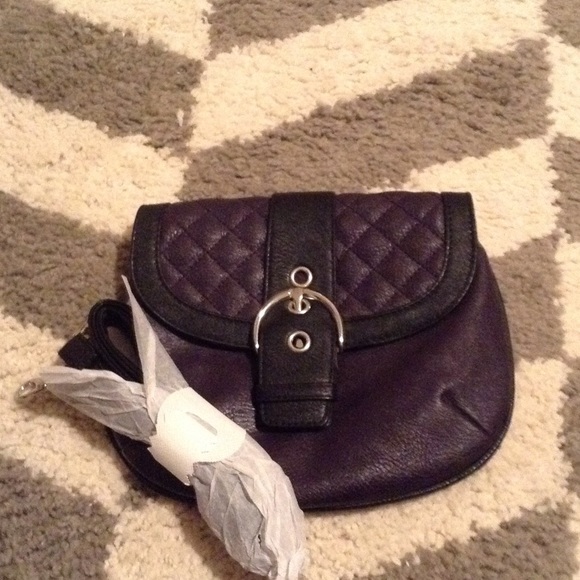 Black and purple clutch with strap included