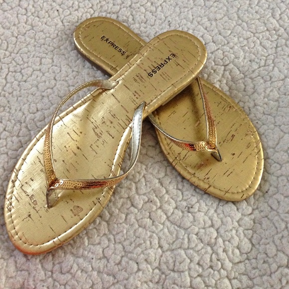 Express gold flip flops