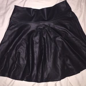 Bundle of leather skirt and flowy top