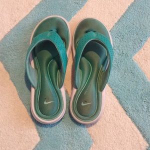 teal Nike memory foam flip flops