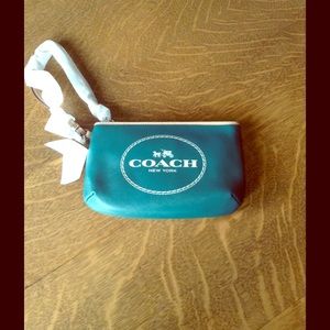 Brand new jade green Coach wristlet.