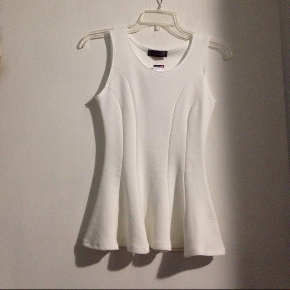 White peplum sleeveless blouse