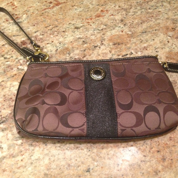Coach wrist key in dark brown and black.