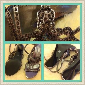 Grey metallic stiletto sandals with jeweled strap.