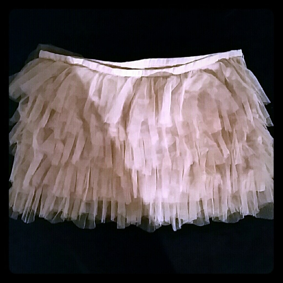 Pale pink ruffled mini skirt
