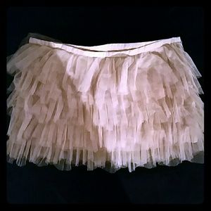 Pale pink ruffled mini skirt