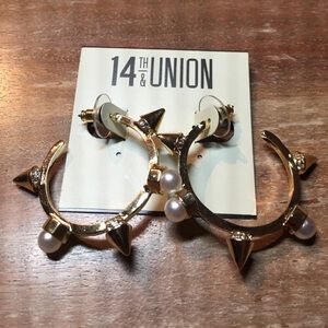 Spike and pearl earrings.