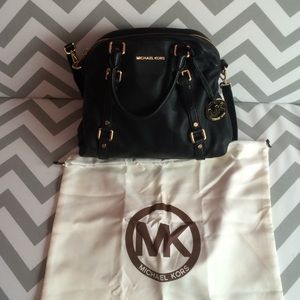 Michael Kors black leather handbag.