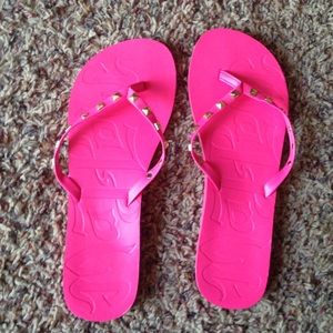 Hot pink flip flops