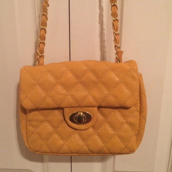 Yellow quilted purse.