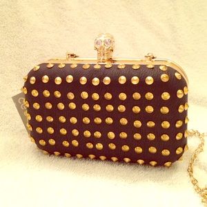 Black studded skull clutch