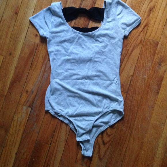 A grey bowed ballerinas piece.