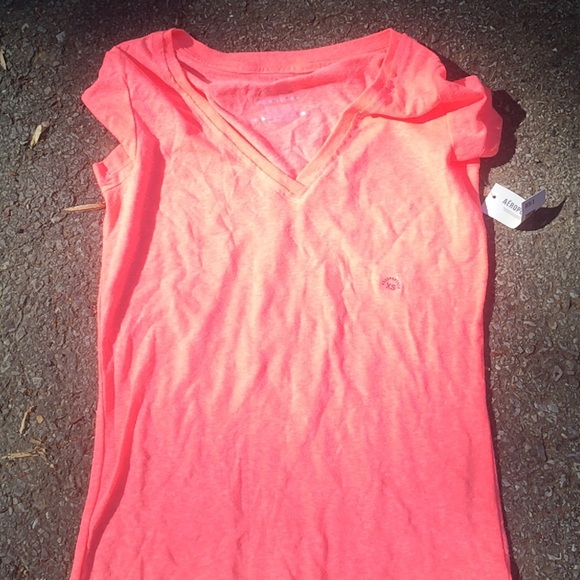 Brand-new pink V-neck shirt