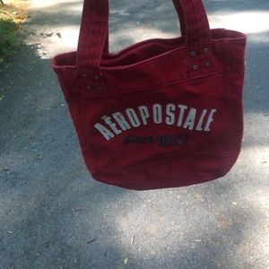 Brand-new. Red bag