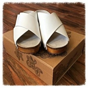 White leather Criss Cross Ecote Clogs.