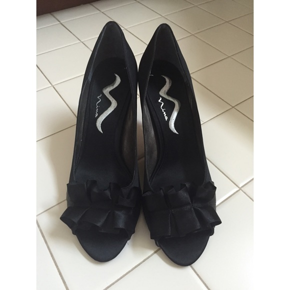 Dressy black peep- toed heel. LIGHTLY WORN