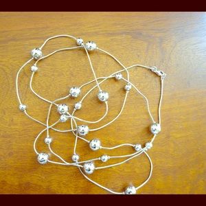 Silver tonned stationery bead long necklace