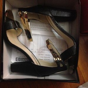 Black and gold heels