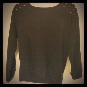 Black sweater with studs on shoulder