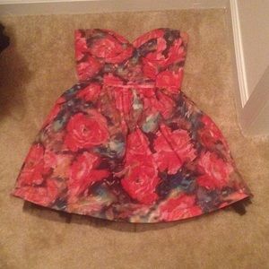 Fitted at the top and a little poof at the bottom.