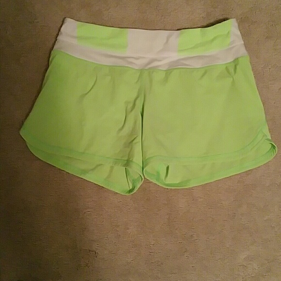 Florescent green lulu running shorts. Size 4