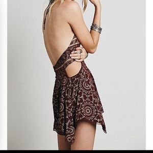 $50 Free people open side foil romper