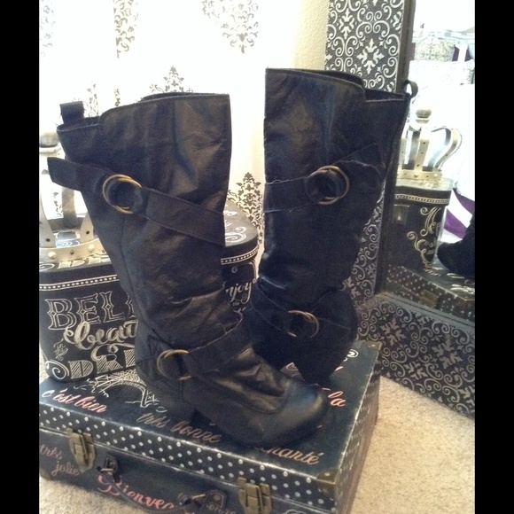 Black leather boots with straps