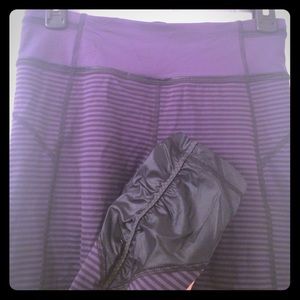 Striped lululemon pants with leather like trim.