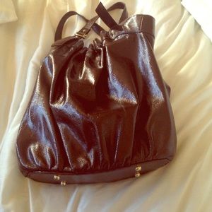 Dark brown purse with gold interior