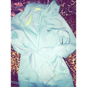 Light blue therma-fit Nike jacket.