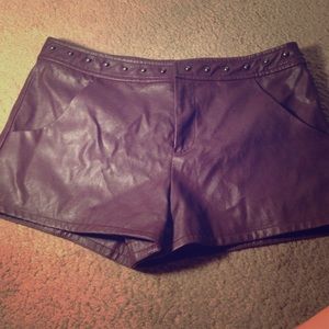 Burgundy studded leather shorts