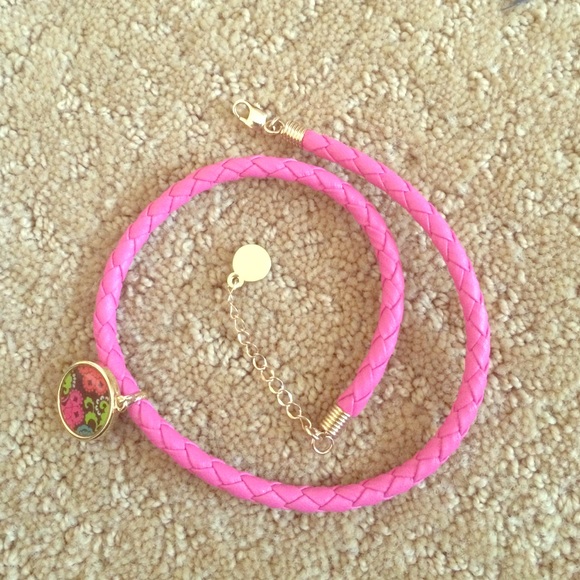 Pink weaved bracelet.