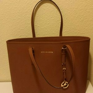 Large authentic MK Tote with laptop pocket.