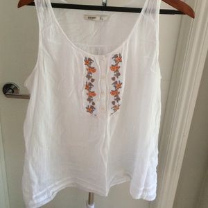 Very light white loose tank with floral accent