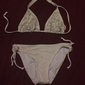 White and silver billabong swim suit