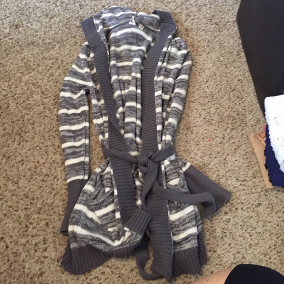 Grey and white sweater.