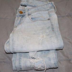 Distressed light wash American eagle jeans