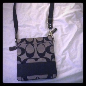 Black and grey coach over the shoulder purse.