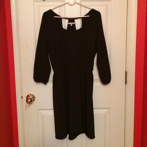 Beautiful black dress with sleeves and fun back