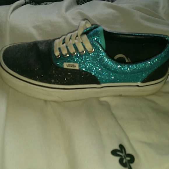 Teal and black glittery vans.